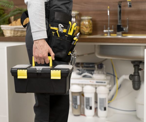 service maintenance worker repairing scaled